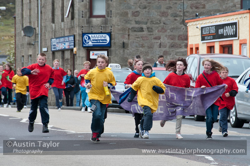 Shetland Youth Clubs try to keep up with the flame, at this time being carried at high speed by Bryden Priest