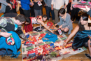 Indian Band members choose gifts from the rug to give to all the guests at the Town Hall at Civic Reception at Lerwick Town Hall, Shetland for the Spirit Dancer Shetland Committee exchange visit by young people from the Osoyoos Indian and Penticton Indian Bands from Canada to Shetland on 27 April 2015