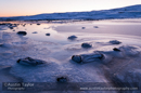 Intertidal ice sculptures at low tide before dusk at Bridge of Walls