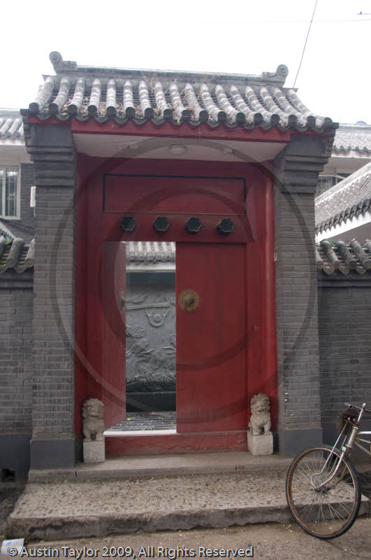 Hutong by rickshaw - important family entrance gate, Beijing