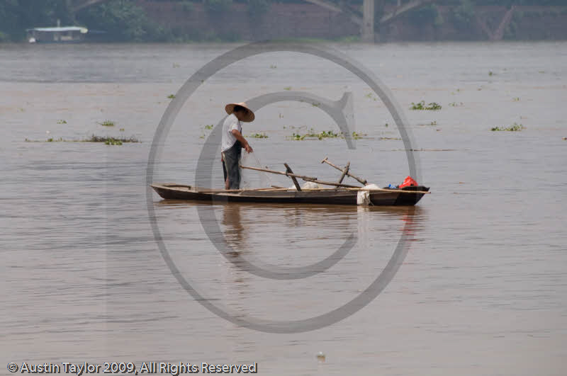 Fisherman on the Min River, Leshan, Sichuan, China
