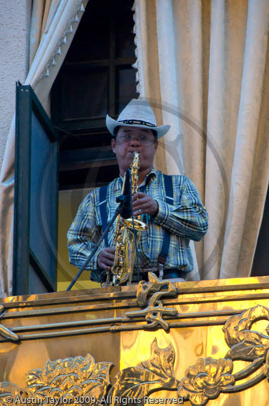 Saxophonist on balcony, Nanjing Road, Shanghai
