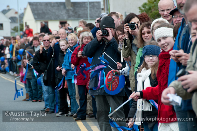 Crowds welcome the arrival of the Olympic torch