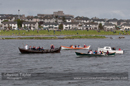 The Olympic flame on board the Vaila Mae, flanked by two yoals as it crosses Clickimin Loch