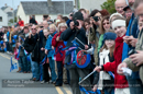 Crowds welcome the arrival of the Olympic torch