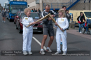 Belle Spence passes the flame to Megan Keppie