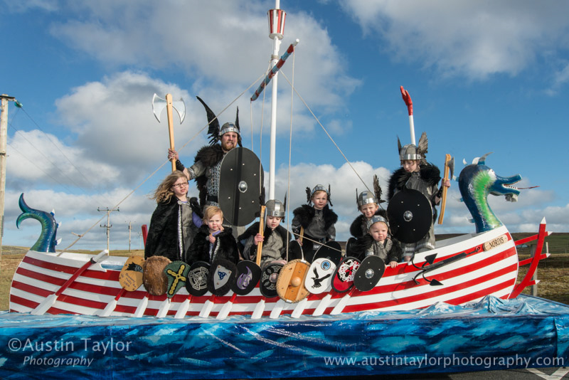 Guizer Jarl Lyle Tulloch with the Jarl Squad Juniors - Breagh MacDonald, Marietta Lowe, Andrew Lowe, Struan MacDonald, Aidan Sands, Alfie Tulloch and Brandon Lowe - Bressay Up Helly-Aa 28 February 2014