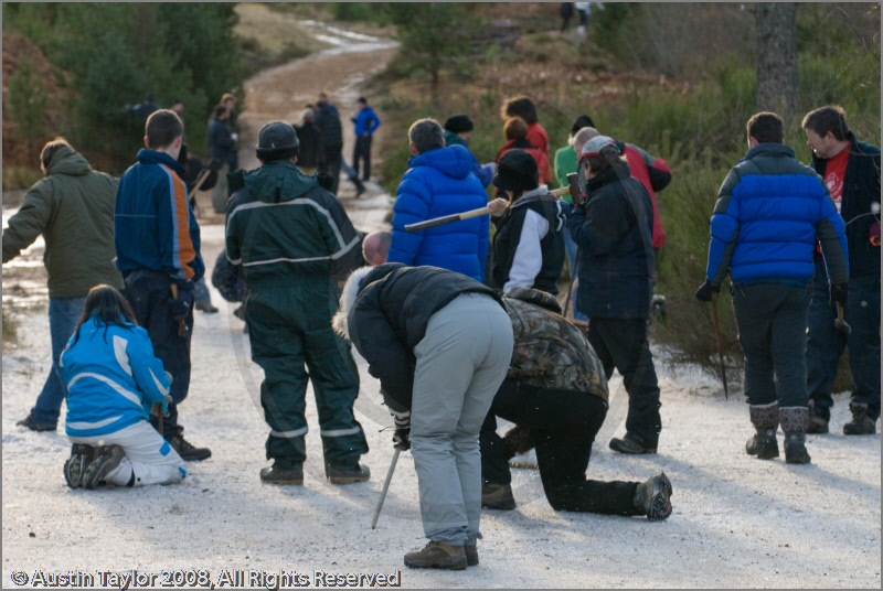 Mushers clearing ice off the track at the 25th Anniversary Siberian Husky Club of Great Britain Aviemore Sled Dog Rally 2008, Rothiemurchus Forest, Aviemore, Highland