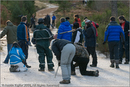 Mushers clearing ice off the track at the 25th Anniversary Siberian Husky Club of Great Britain Aviemore Sled Dog Rally 2008, Rothiemurchus Forest, Aviemore, Highland
