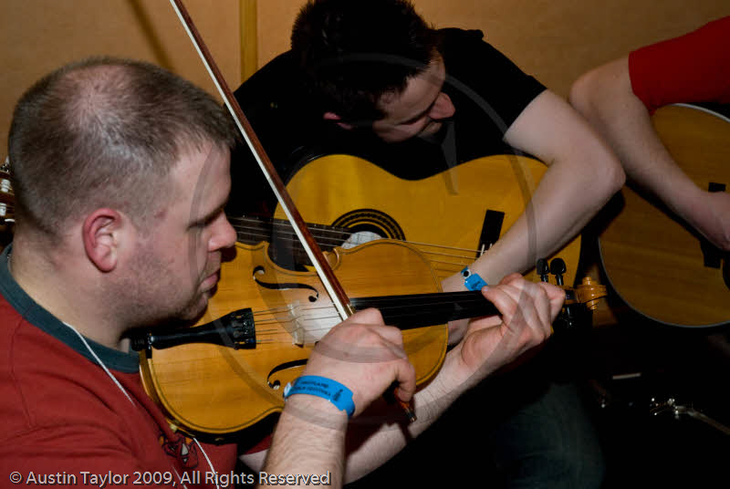 Festival goers and sessions at the Folk Festival Club for the 29th Shetland Folk Festival 2009