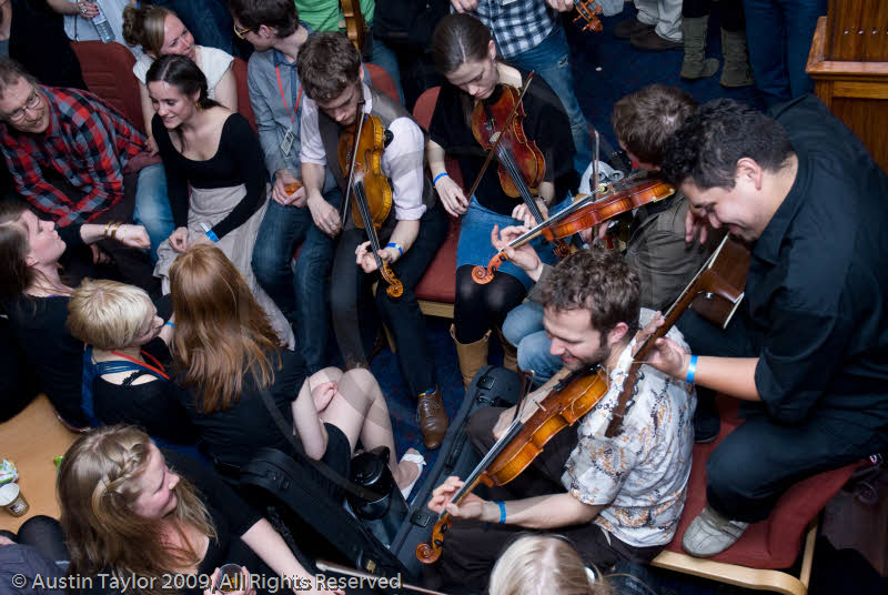Festival goers and sessions at the Folk Festival Club for the 29th Shetland Folk Festival 2009