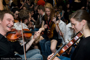 Festival goers and sessions at the Folk Festival Club for the 29th Shetland Folk Festival 2009