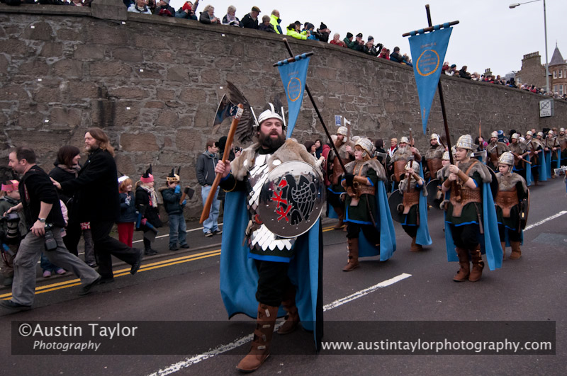 Up Helly-Aa 2011: morning procession - Jarl John Hunter as Johan Sanderrevet of Valsgärde, Sweden, leads his guizers along Esplanade