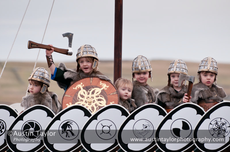 Up Helly-Aa 2011: morning procession - youg boys in the Jarl Sqaud welcome the arrival of the Jarl Squad at Alexandra Wharf