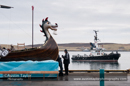 Up Helly-Aa 2011: morning procession - waiting for the arrival of the Jarl Squad at Alexandra Wharf - pilot boat Knab takes a look at the galley