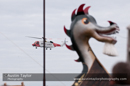 Up Helly-Aa 2011: morning procession - the Coastguard helicopter surveys the galley Jägare at Alexandra Wharf