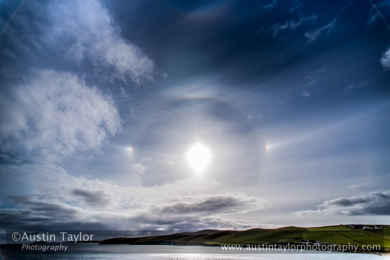 Ice halos at Sandwick, Shetland. From top: circumzenithal arc, upper tangent arc, 22° halo, parhelic circle with parhelia (sun dogs)