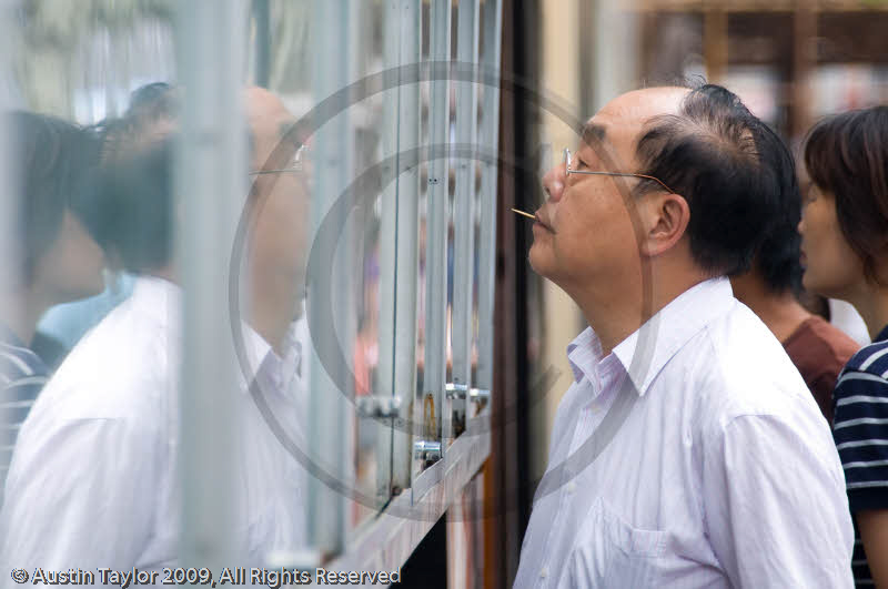 Reading the newspapers, Nanjing Road, Shanghai