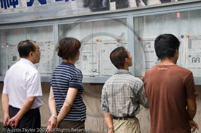 Reading the newspapers, Nanjing Road, Shanghai