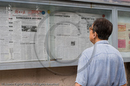Reading the newspapers, Nanjing Road, Shanghai