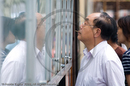 Reading the newspapers, Nanjing Road, Shanghai