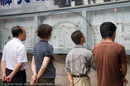 Reading the newspapers, Nanjing Road, Shanghai