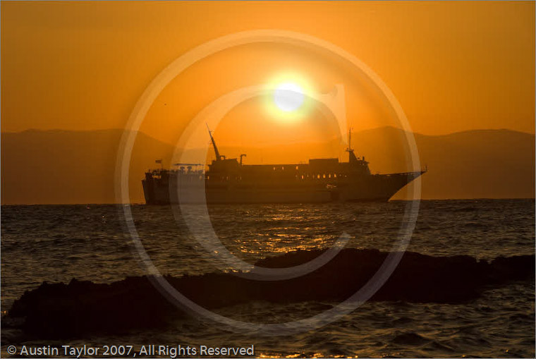 Sunset with ferry and backdrop of the Peloponnese from Aegina, Greece 23 September 2007